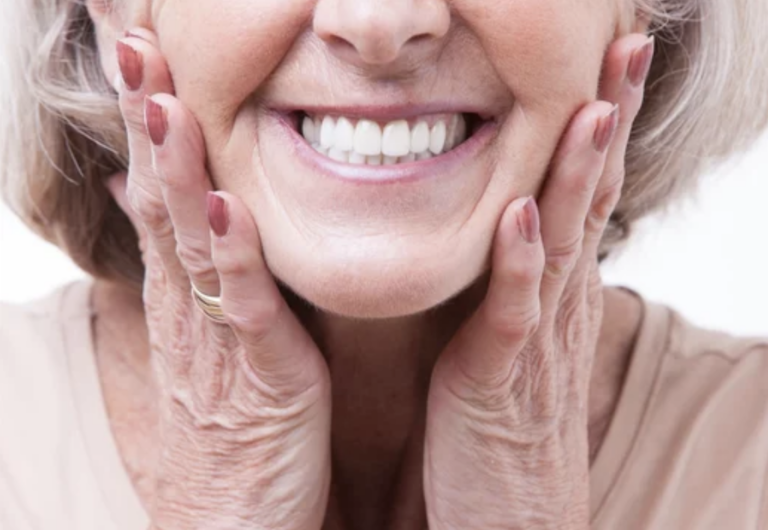 lady with dentures smiling - love to smile