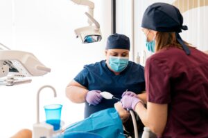 Dental Clinic Workers With Young Patient