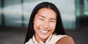 Asian girl smiling on camera during winter time outdoor